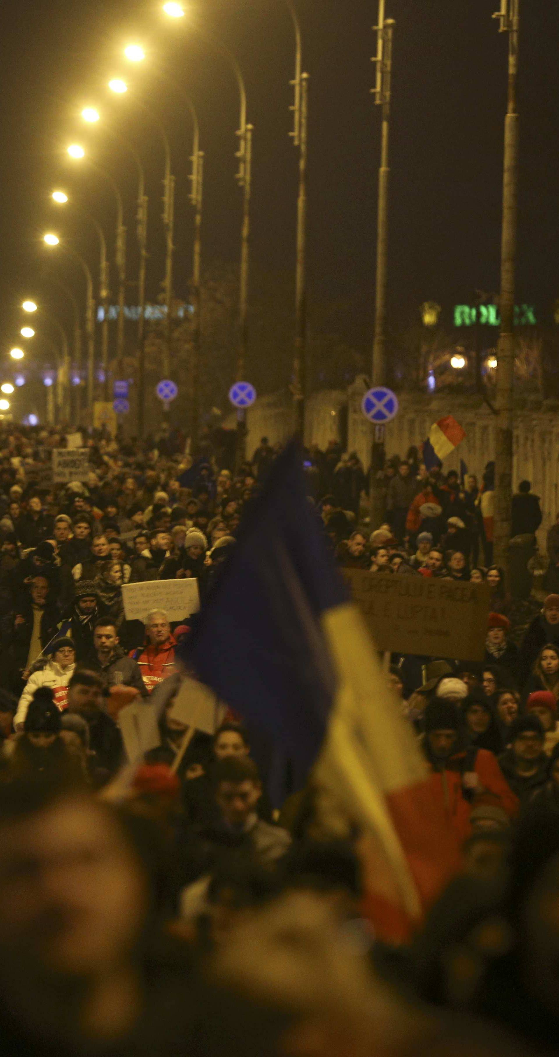 People demonstrate against cabinet decree passed earlier in week decriminalising some graft offences, in Bucharest