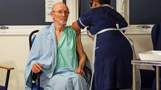 "Bill" William Shakespeare, 81, receives the Pfizer/BioNTech  COVID-19 vaccine at University Hospital in Coventry