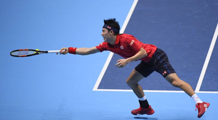 Japan's Kei Nishikori in action during his round robin match with Great Britain's Andy Murray