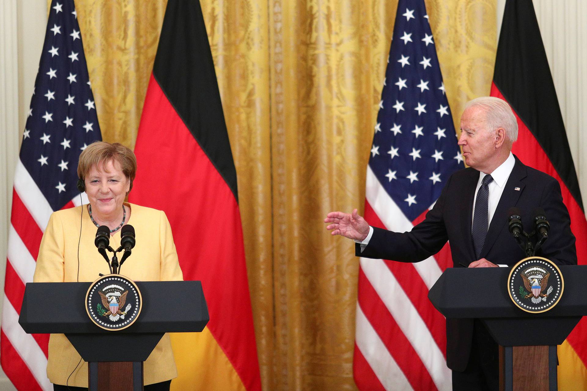 U.S. President Joe Biden and German Chancellor Angela Merkel attend a joint news conference in the East Room at the White House