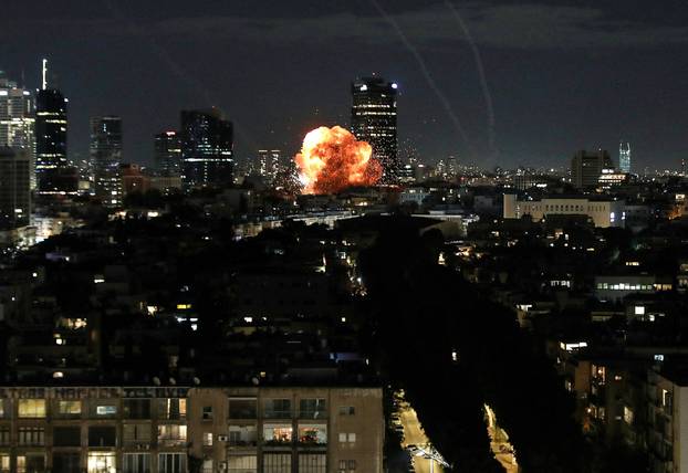 An explosion caused by a projectile impact after Iran launched missiles into Israel following Israel and the U.S. launched strikes on Iran, in Tel Aviv