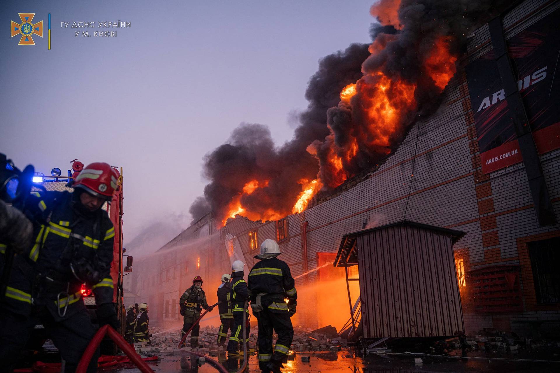 Rescues work at a site of buildings damaged by a shelling in Kyiv