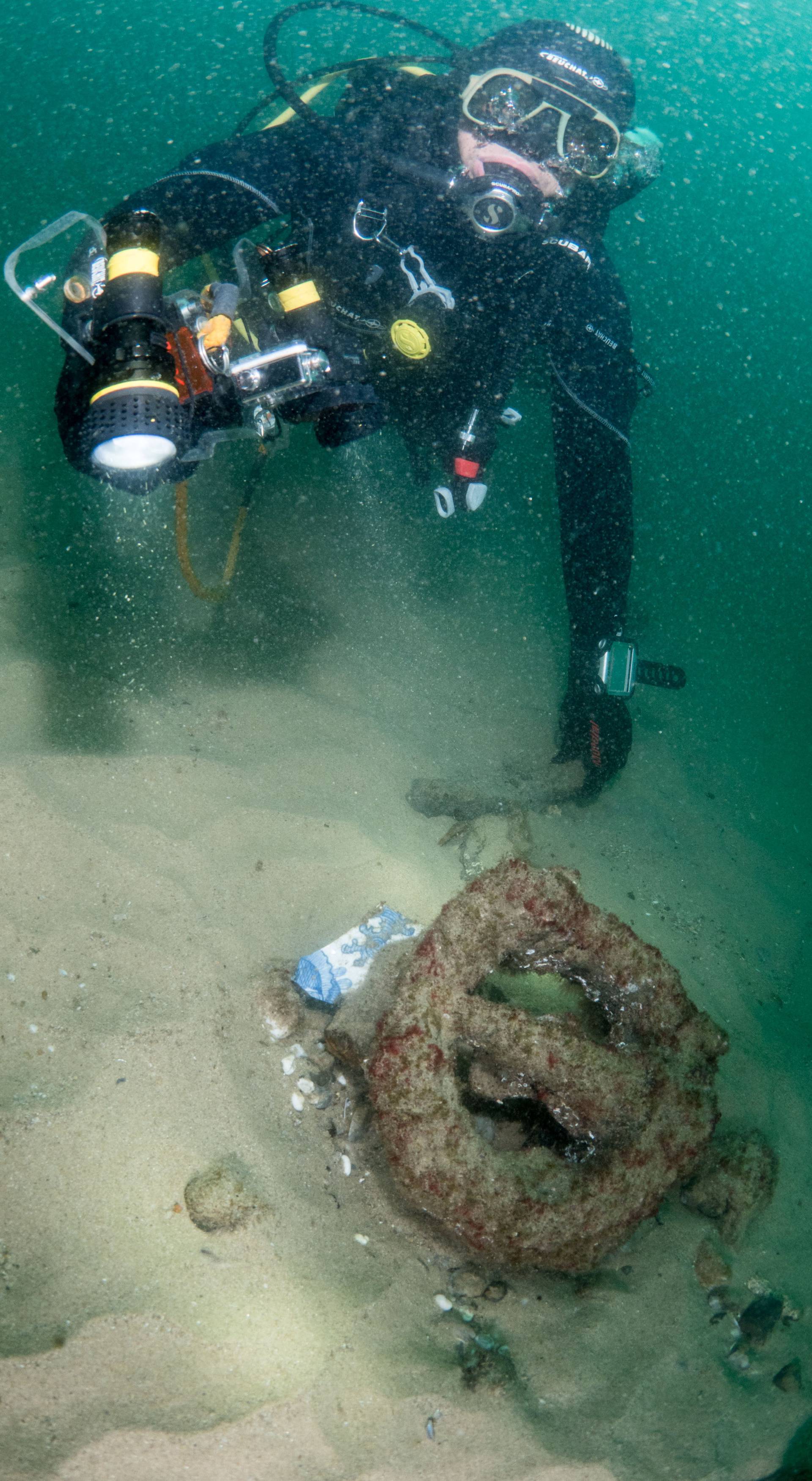 Divers are seen during the discovery of a centuries-old shipwreck, in Cascais