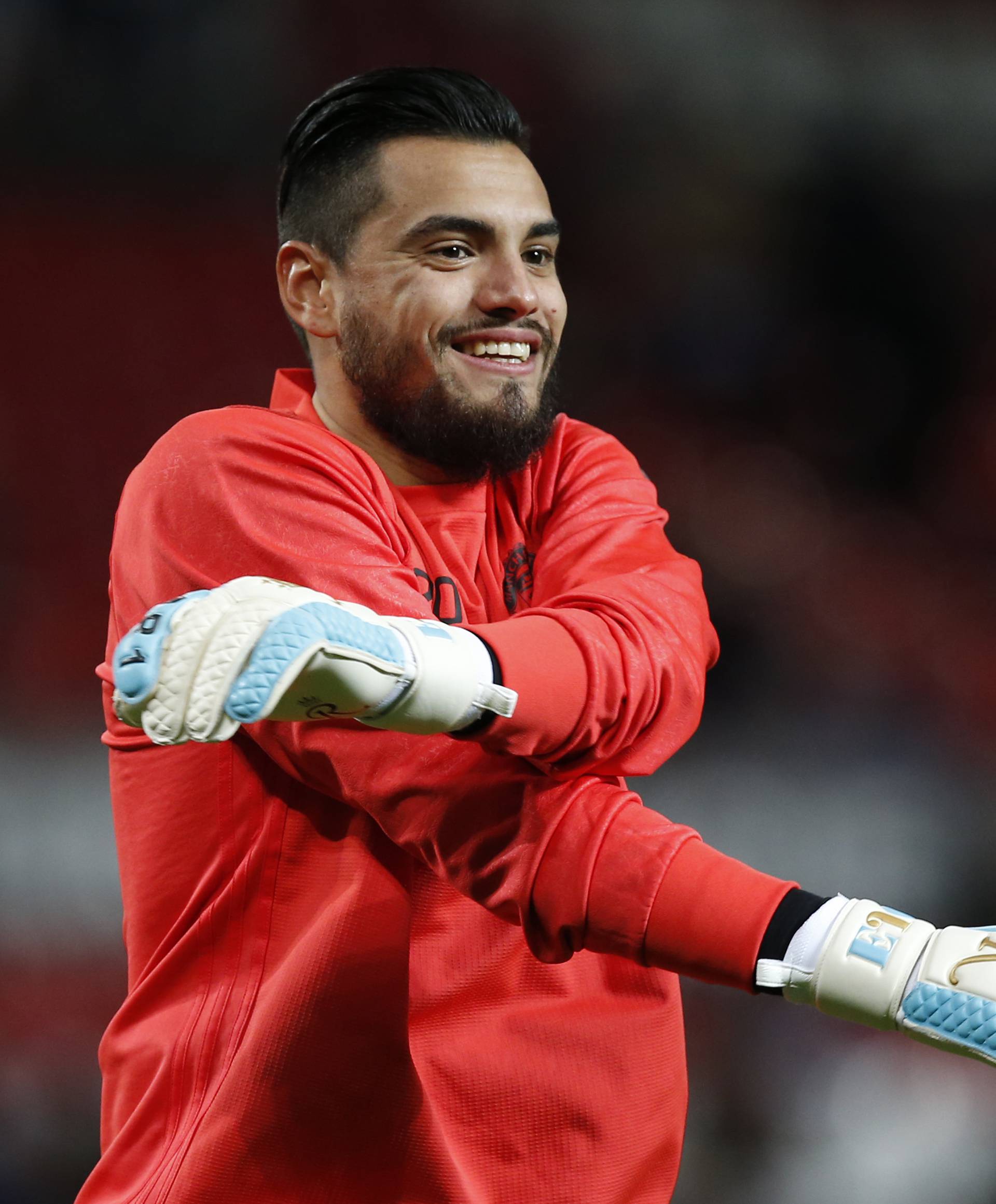 Manchester United's Sergio Romero warms up before the match