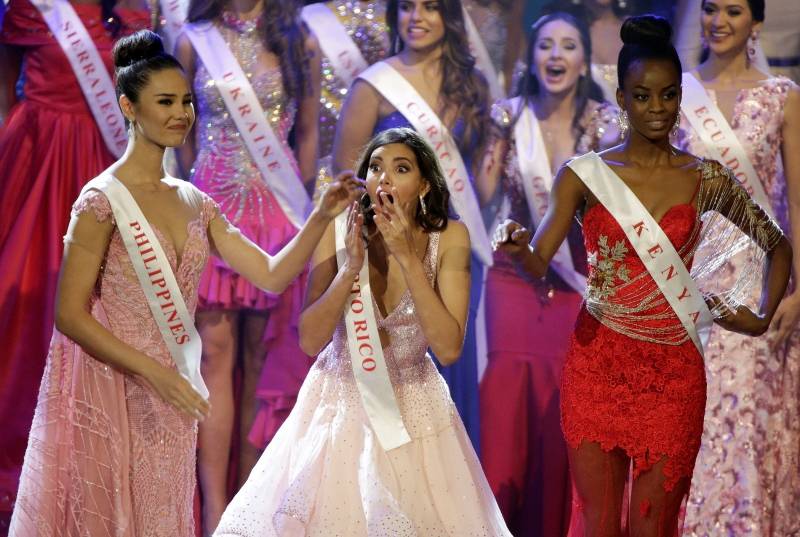 Miss Puerto Rico Stephanie Del Valle reacts to being named Miss World as Miss Philippines Catriona Elisa Gray (L) and Miss Kenya Evelyn Njambi Thungu watch during in the Miss World 2016 Competition in Oxen Hill