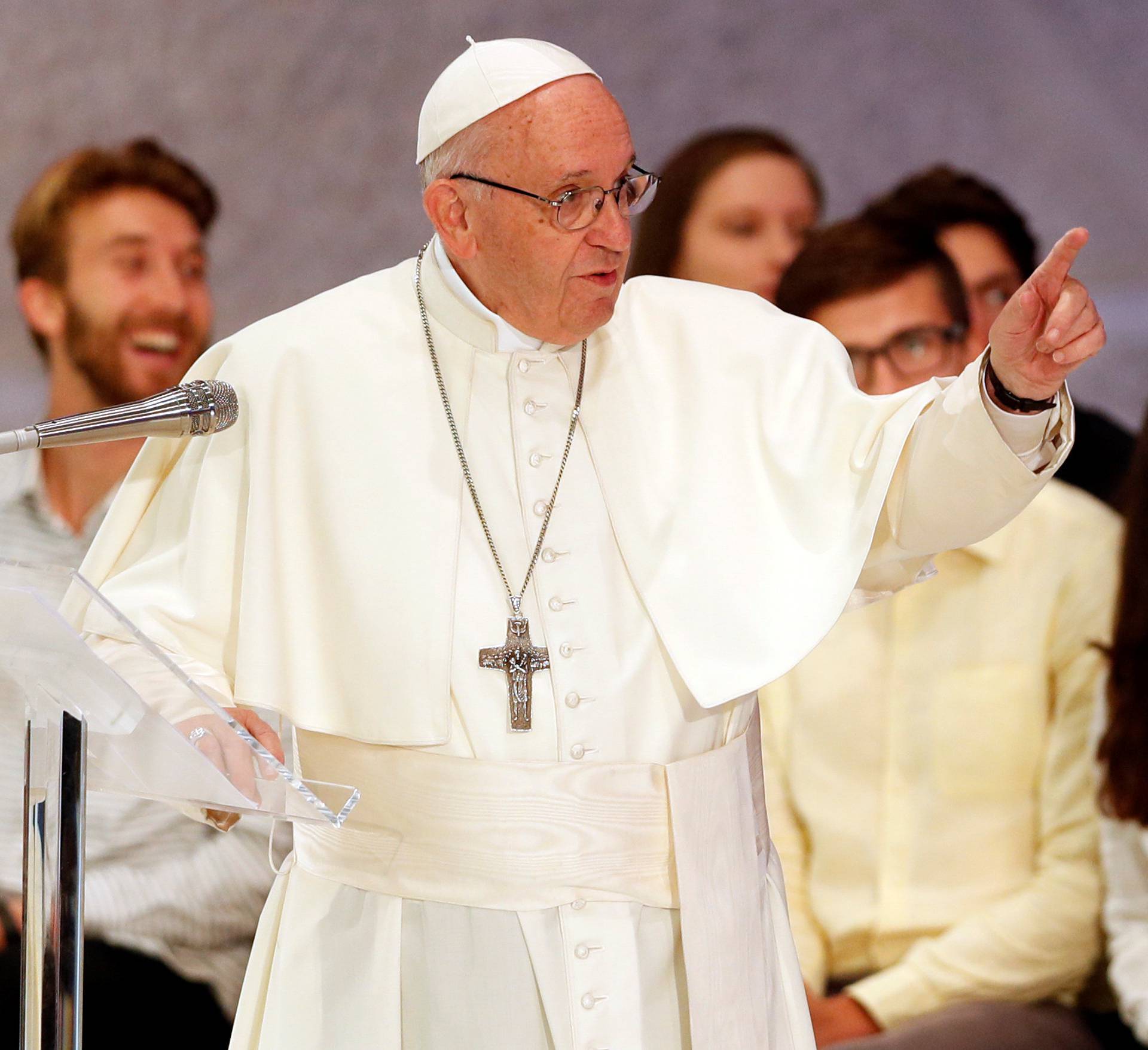 Pope Francis talks as he meets youth and the Synod Fathers at the Pope Paul VI hall in Vatican