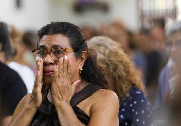 People attend Mass during a national day of prayer, following earthquakes in Valencia