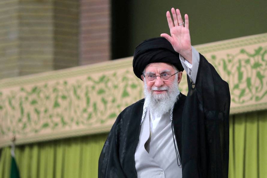 FILE PHOTO: Iran's Supreme Leader Ayatollah Ali Khamenei waves during a meeting with students in Tehran