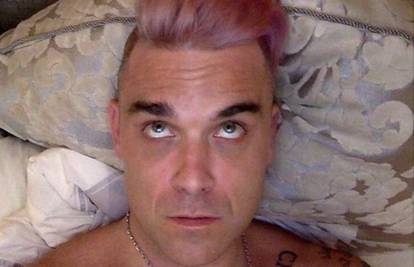 Robbie Williams: Moja kosa se transformira kao Bruce Jenner