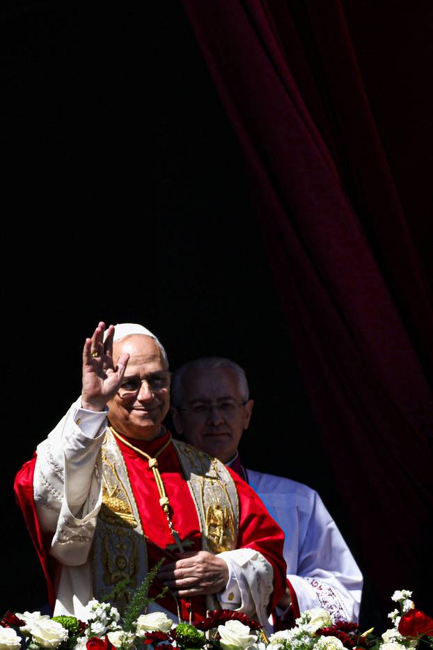 Pope Leo XIV delivers his "Urbi et Orbi" (To the city and the world) message from the main balcony of St. Peter's Basilica at the Vatican