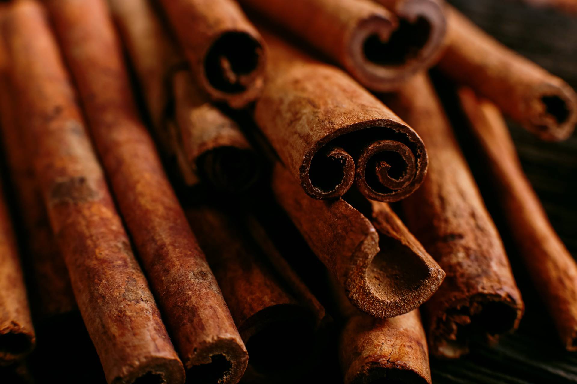 Spices sticks cinnamon on the old table. Rustic background, aroma close-up.