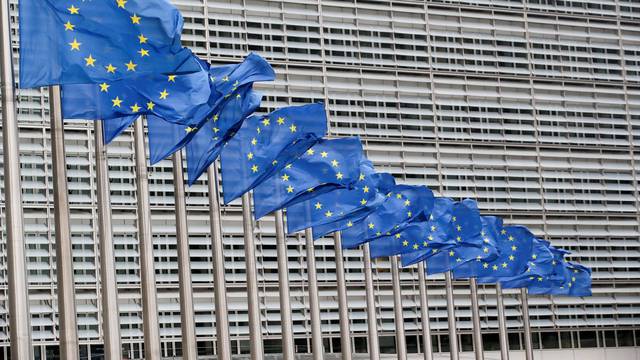 FILE PHOTO: Flags flutter outside EU Commission in Brussels