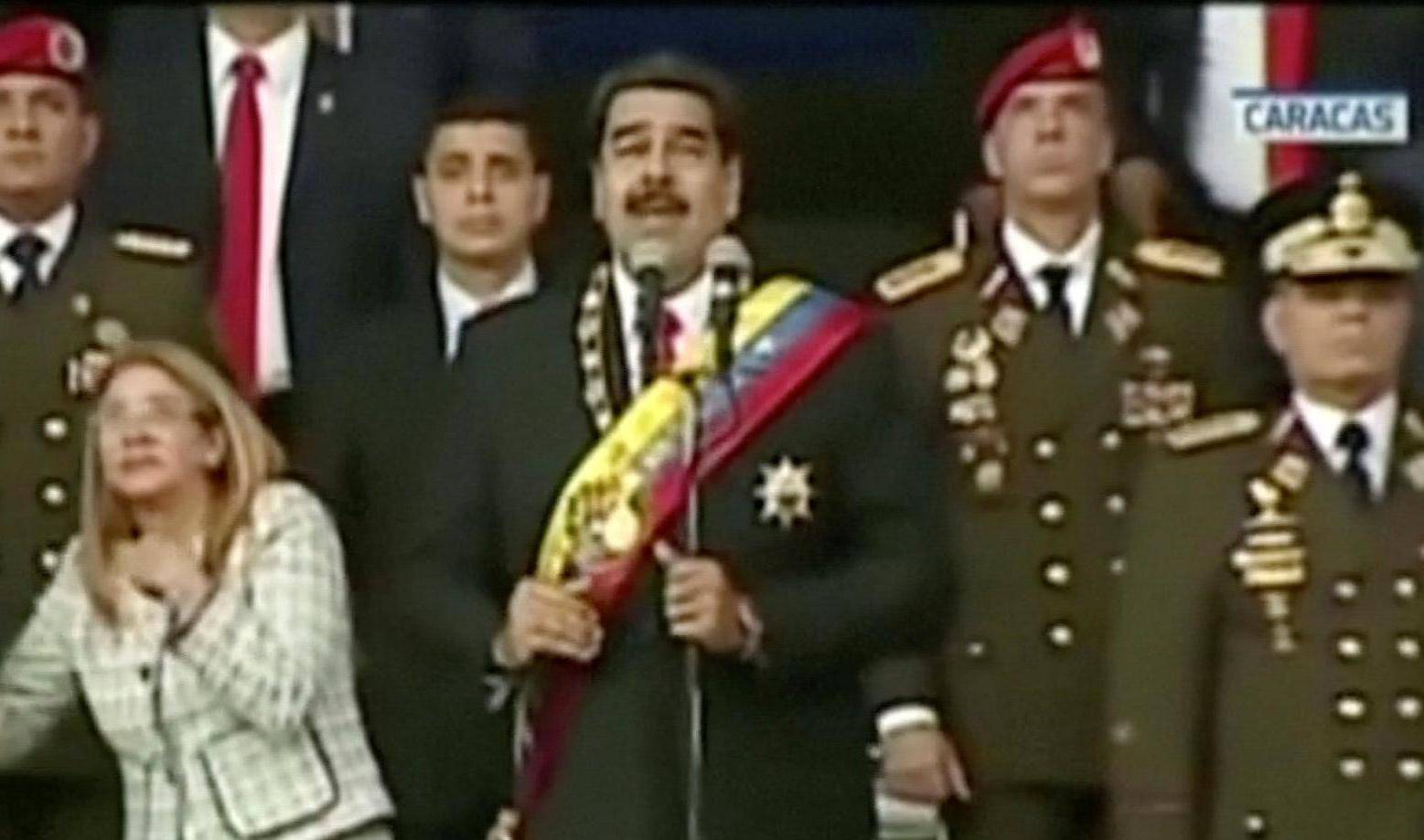 Venezuelan President Nicolas Maduro reacts during an event which was interrupted, in this still frame taken from video