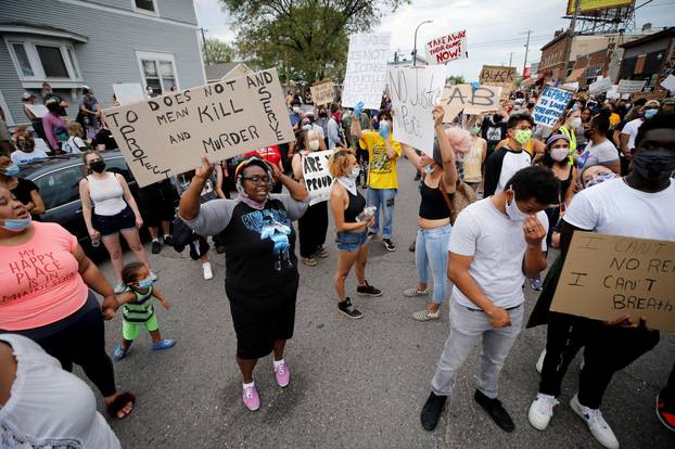 Protesters gather at the scene where Floyd was pinned down by a police officer in Minneapolis