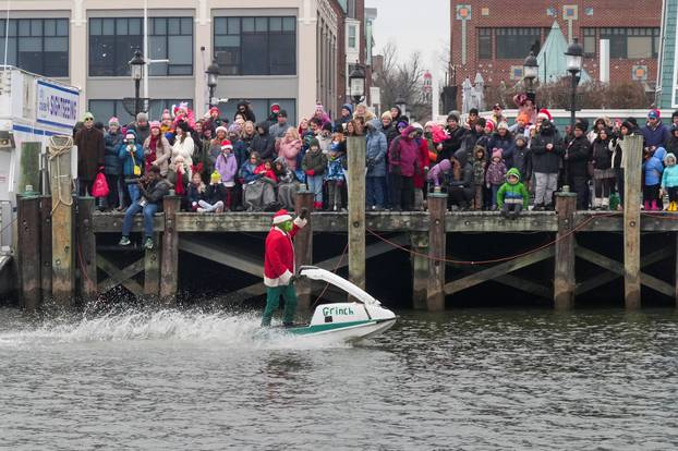 "Waterskiing Santa" skis along the Old Town Alexandria Waterfront in Virginia