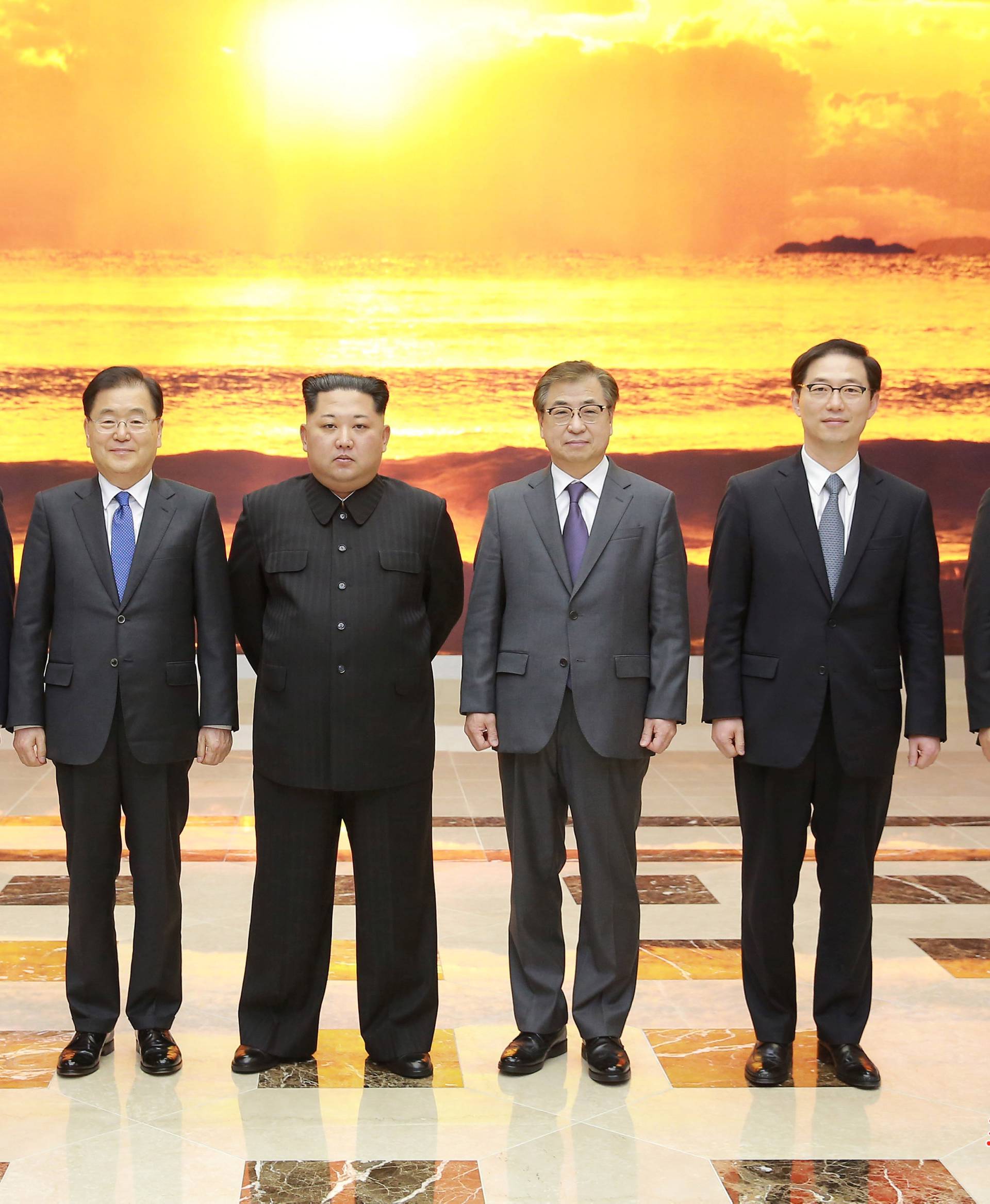 North Korean leader Kim Jong Un meets members of the special delegation of South Korea's President in this photo released by North Korea's Korean Central News Agency