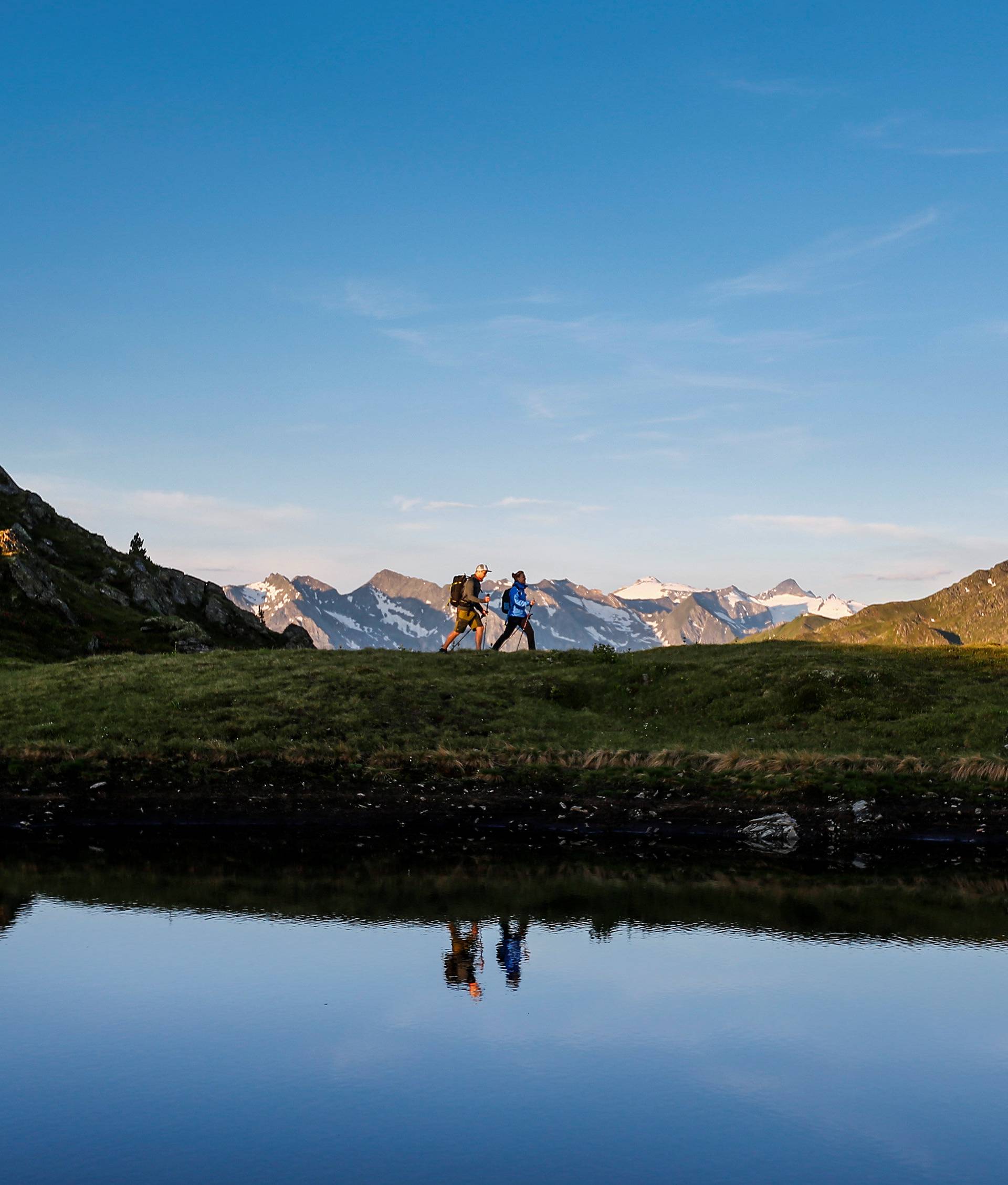 A couple hikes during sunrise on Kreuzjoch mountain in the Zillertal Alps in Schwendau