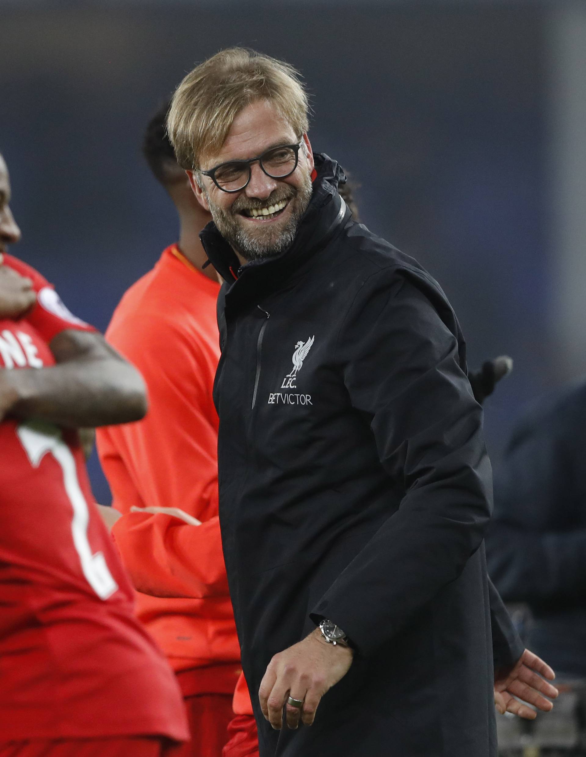 Liverpool manager Juergen Klopp celebrates after the match with their players