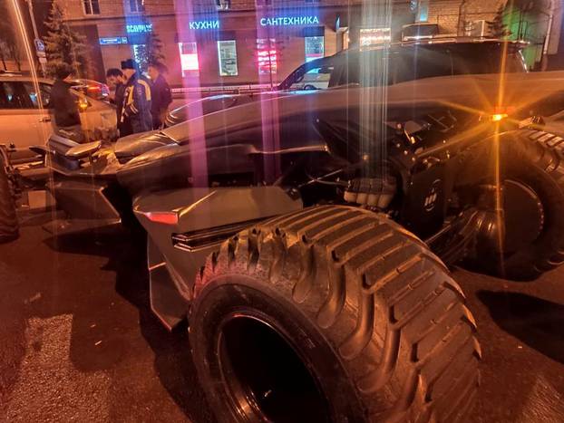 A vehicle resembling the Batmobile from the film "Batman v Superman: Dawn of Justice" stopped by traffic police in Moscow, is seen in this handout photo
