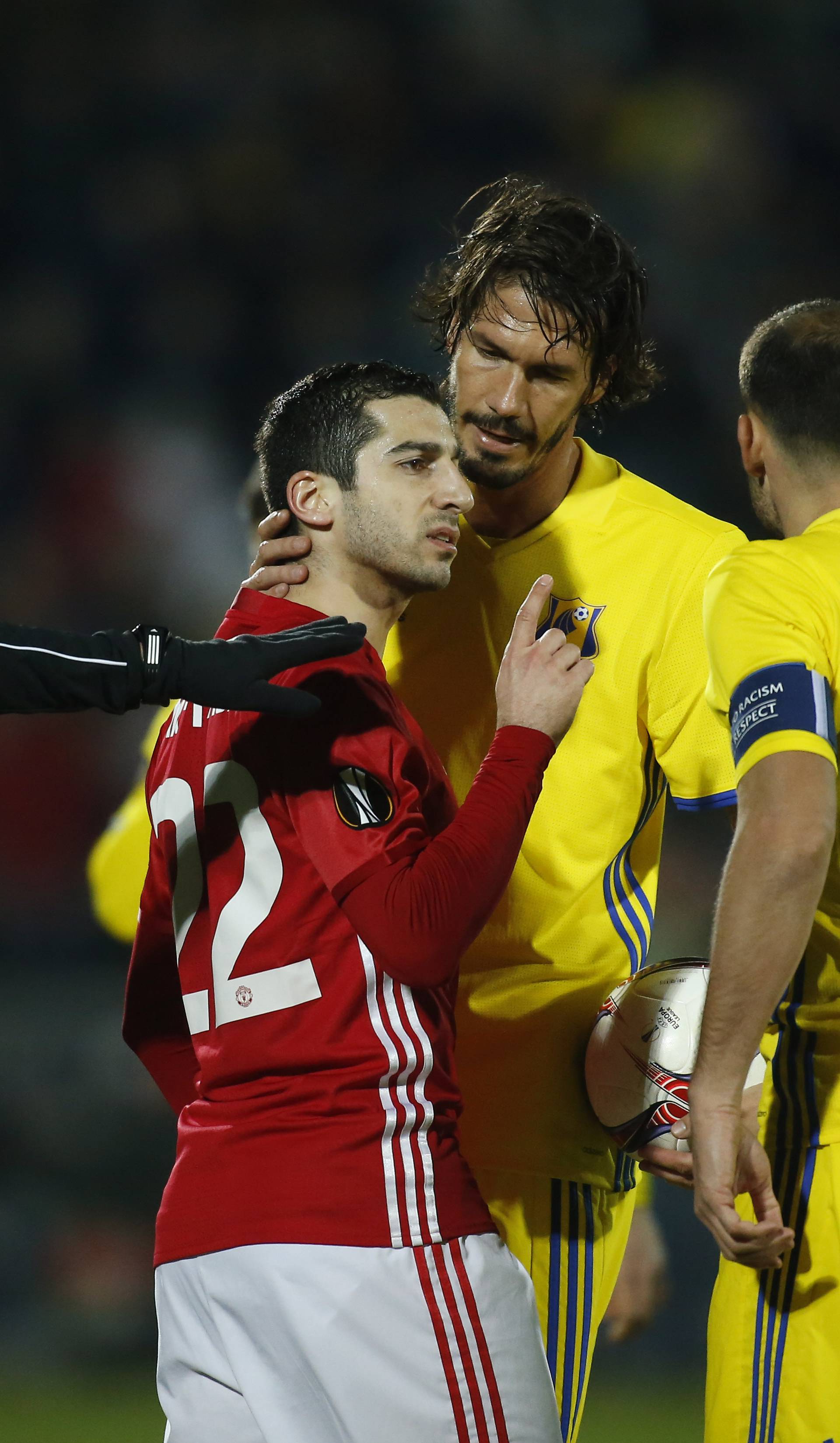 Manchester United's Henrikh Mkhitaryan clashes with FC Rostov's Aleksandru Gatcan