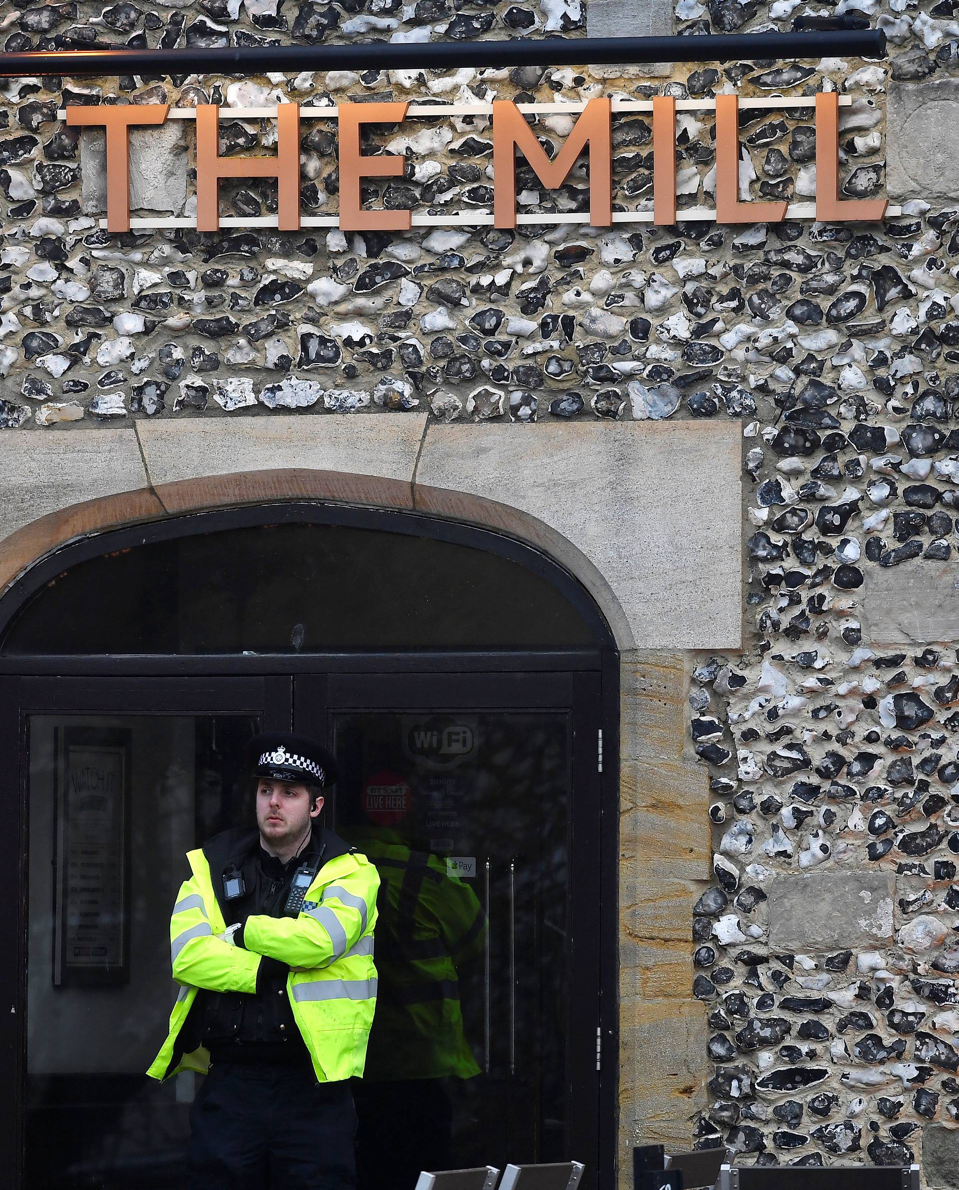 A police officer stands on duty after former Russian inteligence officer Sergei Skripal, and a woman were found unconscious on a bench nearby after they had been exposed to an unknown substance, in Salisbury