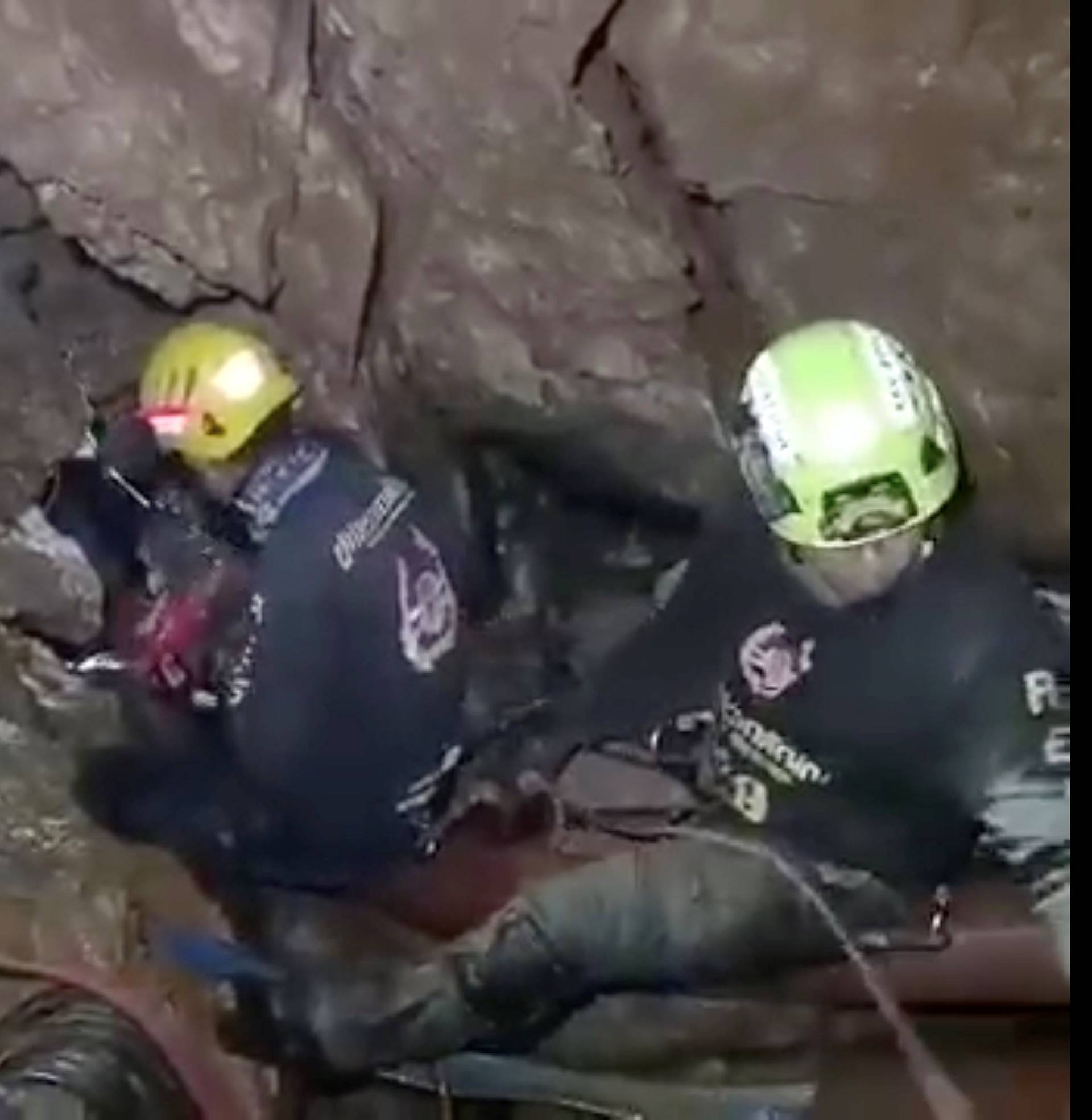 Ruamkatanyu Foundation rescuers are seen trying to find alternative entrance to the Tham Luang cave complex