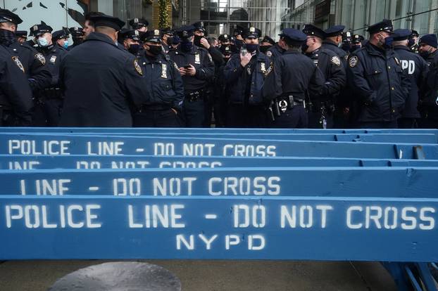 Police attend a muster point near Times Square ahead of New Year