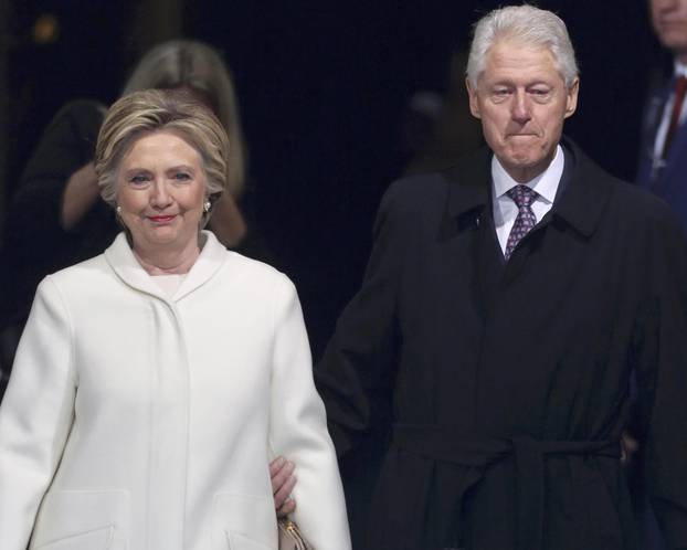 Former president Bill Clinton and former Democratic presidential candidate Hillary Clinton arrive at inauguration ceremonies swearing in Donald Trump as the 45th president of the United States on the West front of the U.S. Capitol in Washington