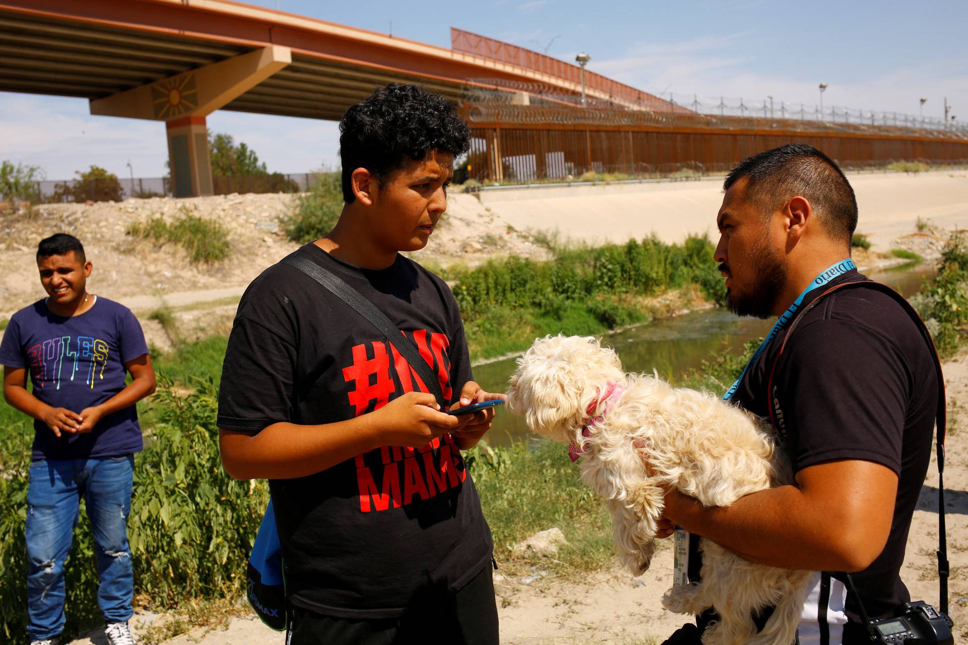 Venezuelan migrant Brayan Pinto returns to Ciudad Juarez to drop off his dog after crossing the Rio Bravo river and turning himself in to the U.S. Border Patrol in order to request asylum