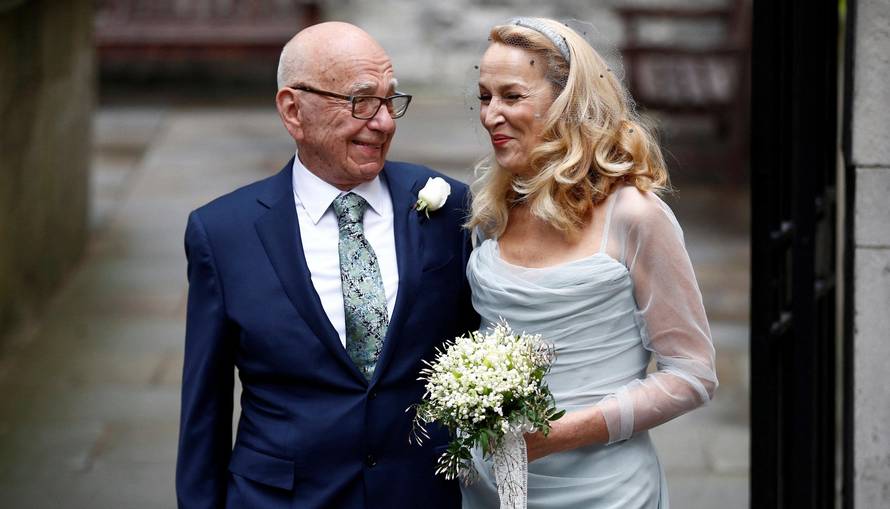 FILE PHOTO: Media Mogul Rupert Murdoch and former supermodel Jerry Hall pose for a photograph outside St Bride's church following a service to celebrate their wedding which took place on Friday, in London