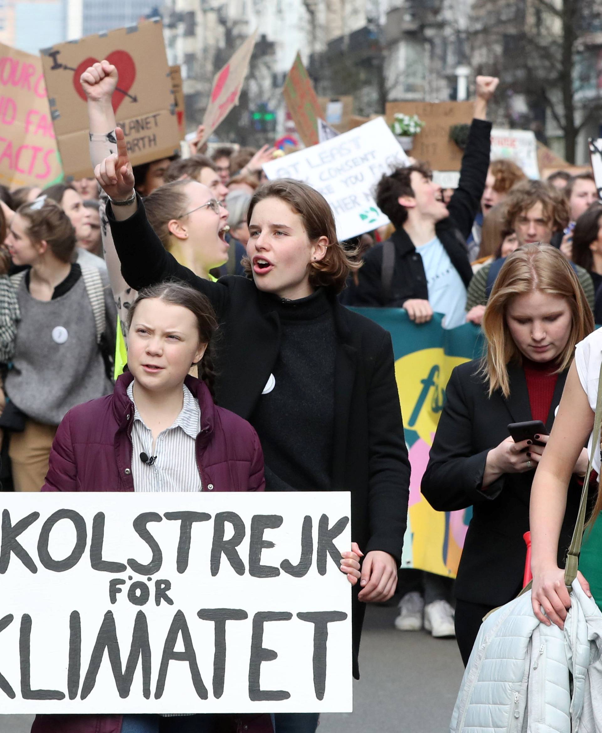 Swedish environmental activist Greta Thunberg and Anuna De Wever, a Belgian climate student activist take part in a protest claiming for urgent measures to combat climate, in central Brussels