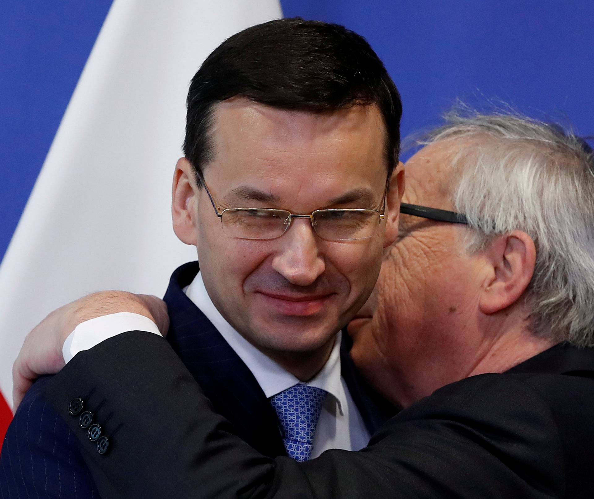 FILE PHOTO: Poland's Prime Minister Morawiecki is welcomed by European Commission President Juncker in Brussels
