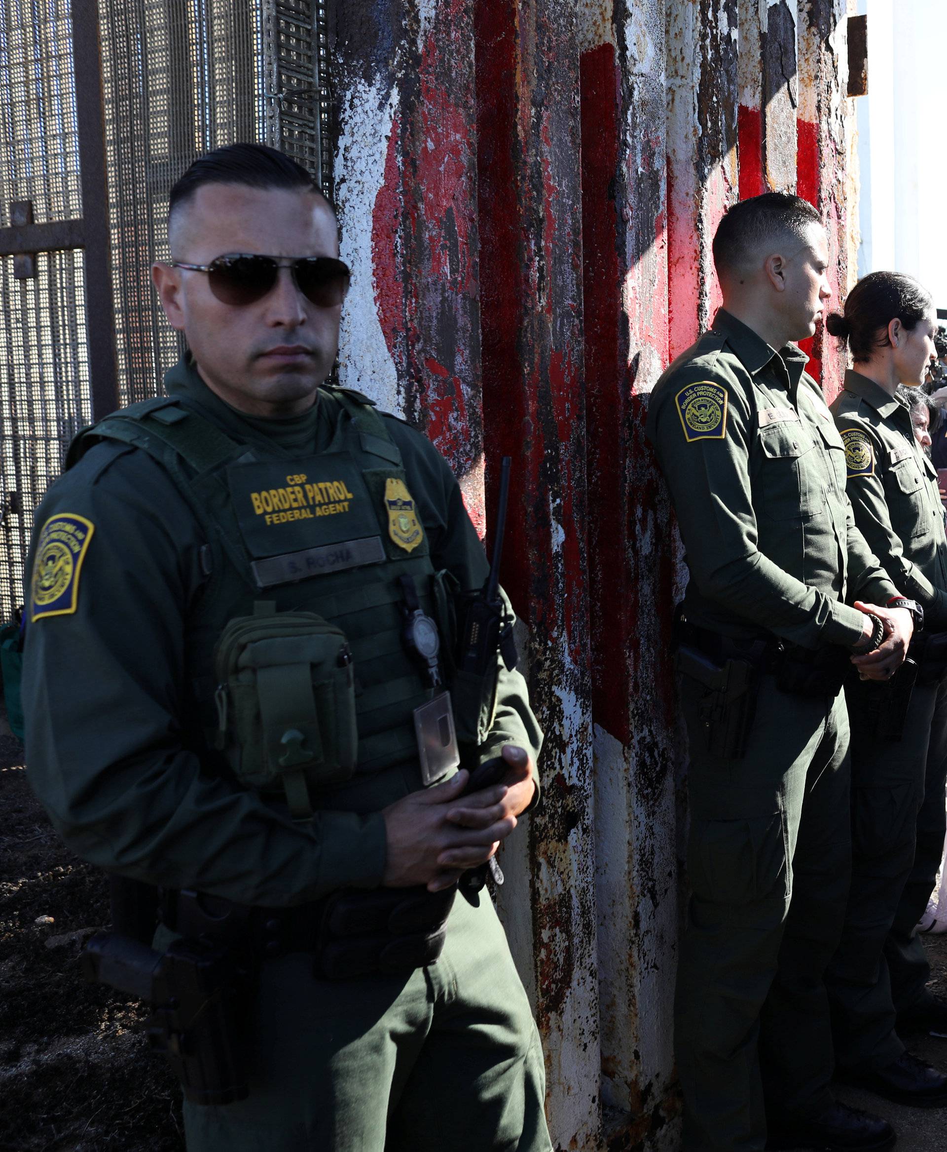 U.S. resident Brian Houston marries Evelia Reyes as U.S. Border Patrol agents open a single gate in the border wall to allow selected families to visit along the U.S.-Mexico border in San Diego