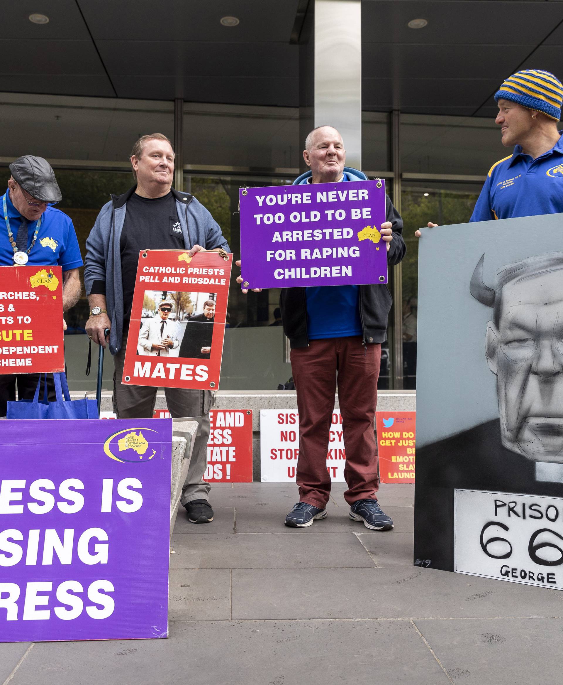 Protesters of Cardinal George Pell are seen outside the County Court in Melbourne