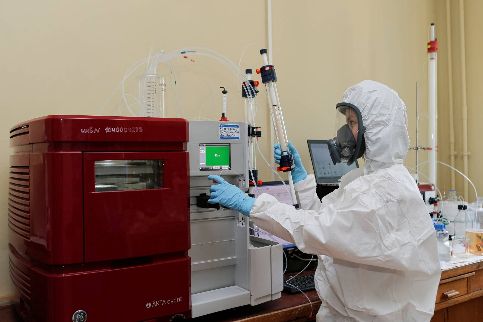 A scientist works inside a laboratory during the production and laboratory testing of a vaccine against the coronavirus disease in Moscow