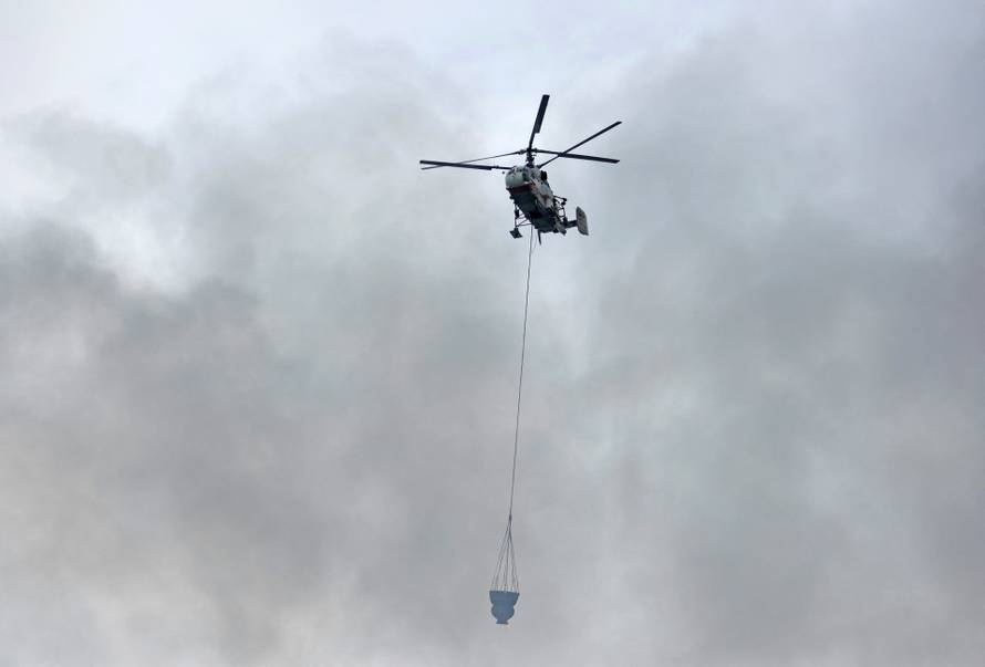 Firefighters extinguish a fire at a business centre in Moscow