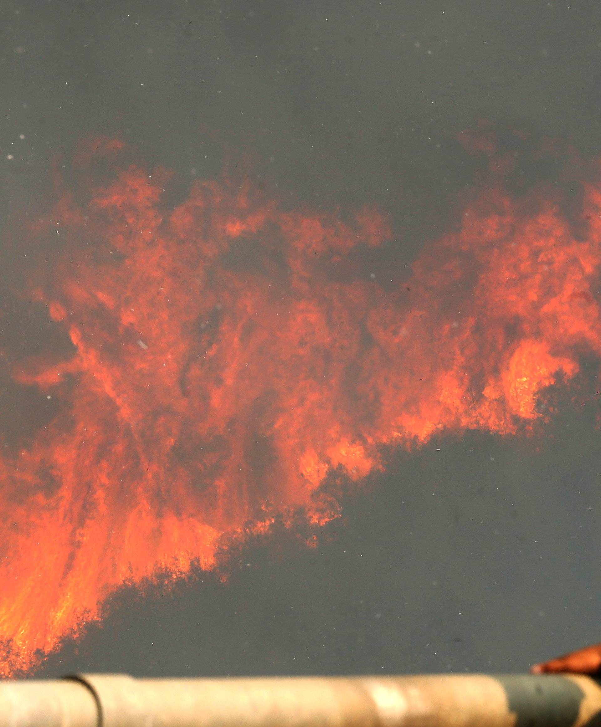 Fire is seen on a hill, where more than 100 homes were burned due to forest fire but there have been no reports of death, local authorities said in Valparaiso, Chile