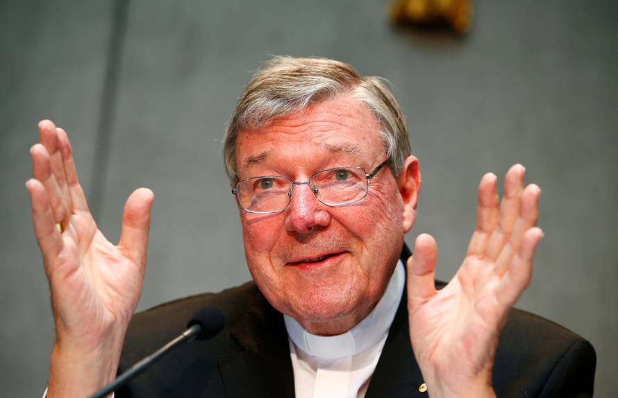 FILE PHOTO - Cardinal George Pell gestures as he talks during a news conference for the presentation of new president of Vatican Bank IOR, at the Vatican