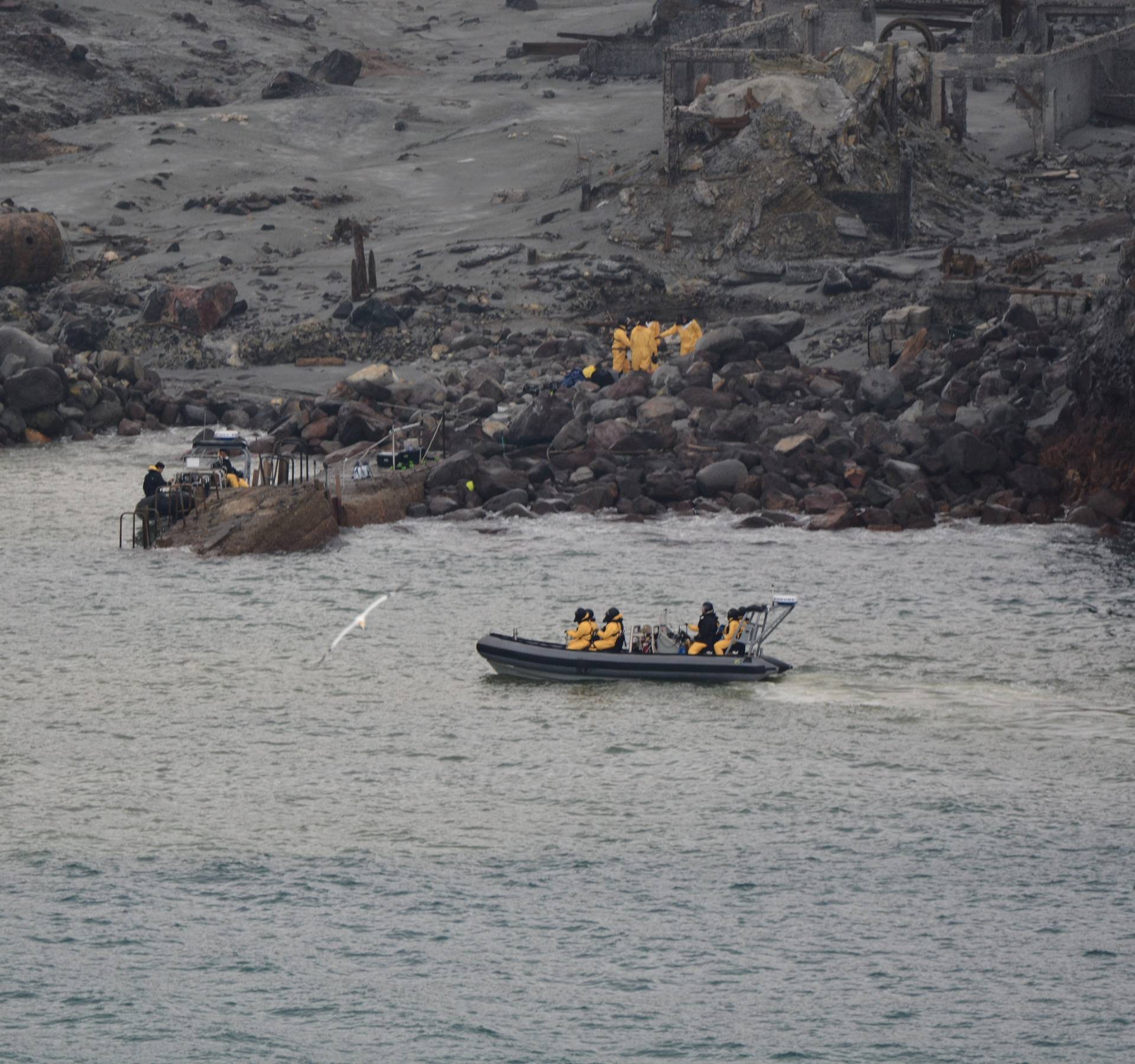 Rescue crew are seen at the White Island volcano in New Zealand