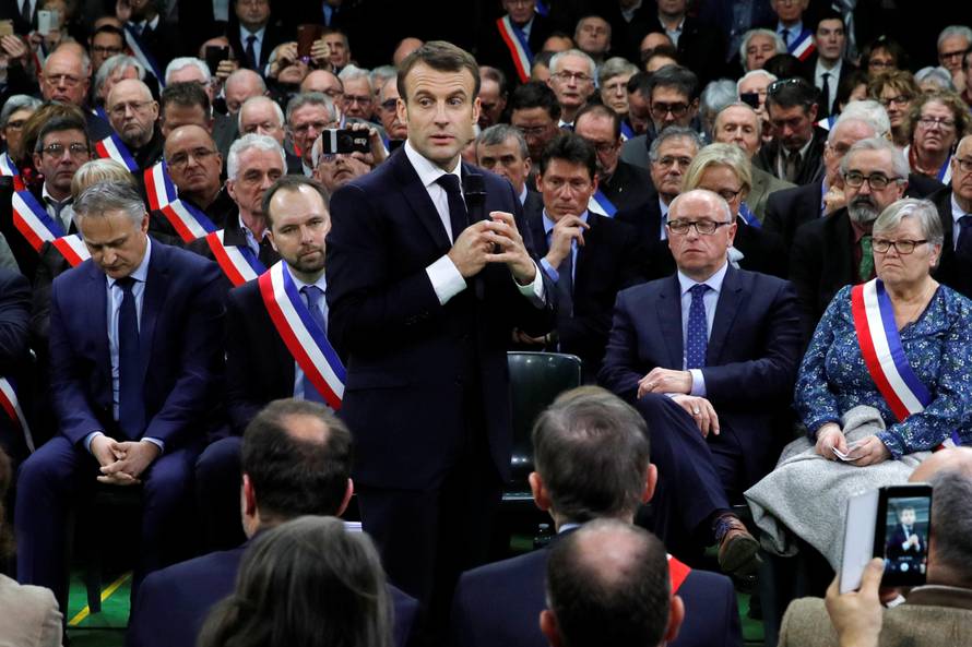 French President Emmanuel Macron attends a meeting with mayors from rural Normandy as part of the launching of the "Great National Debate" in Grand Bourgtheroulde