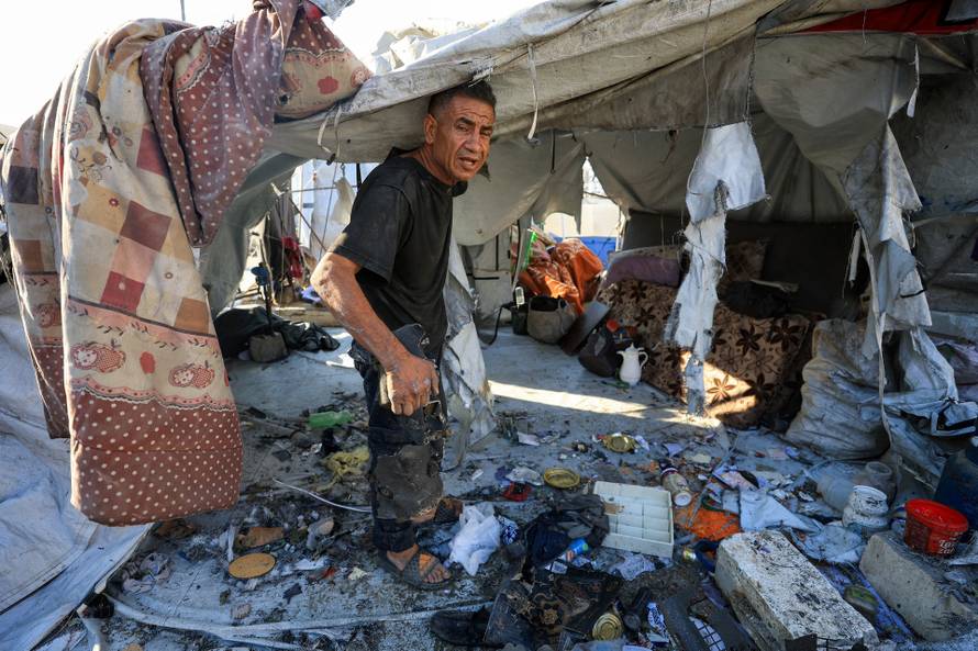 Aftermath of an overnight Israeli strike on a tent sheltering displaced people, in Gaza City