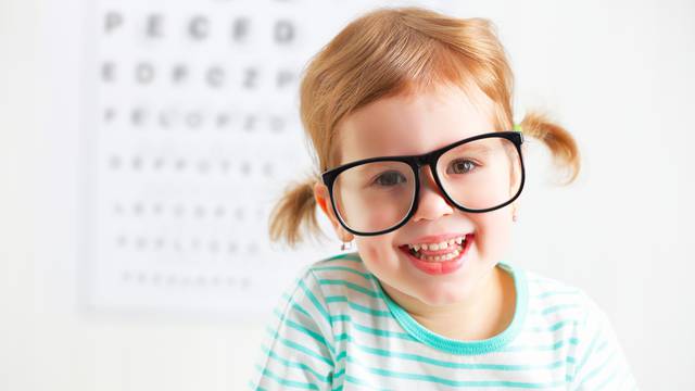 concept vision testing. child  girl with eyeglasses