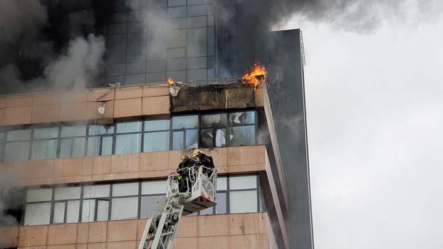 Firefighters extinguish a fire at a business centre in Moscow