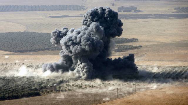 Smoke rises at Islamic State militants' positions in the town of Naweran
