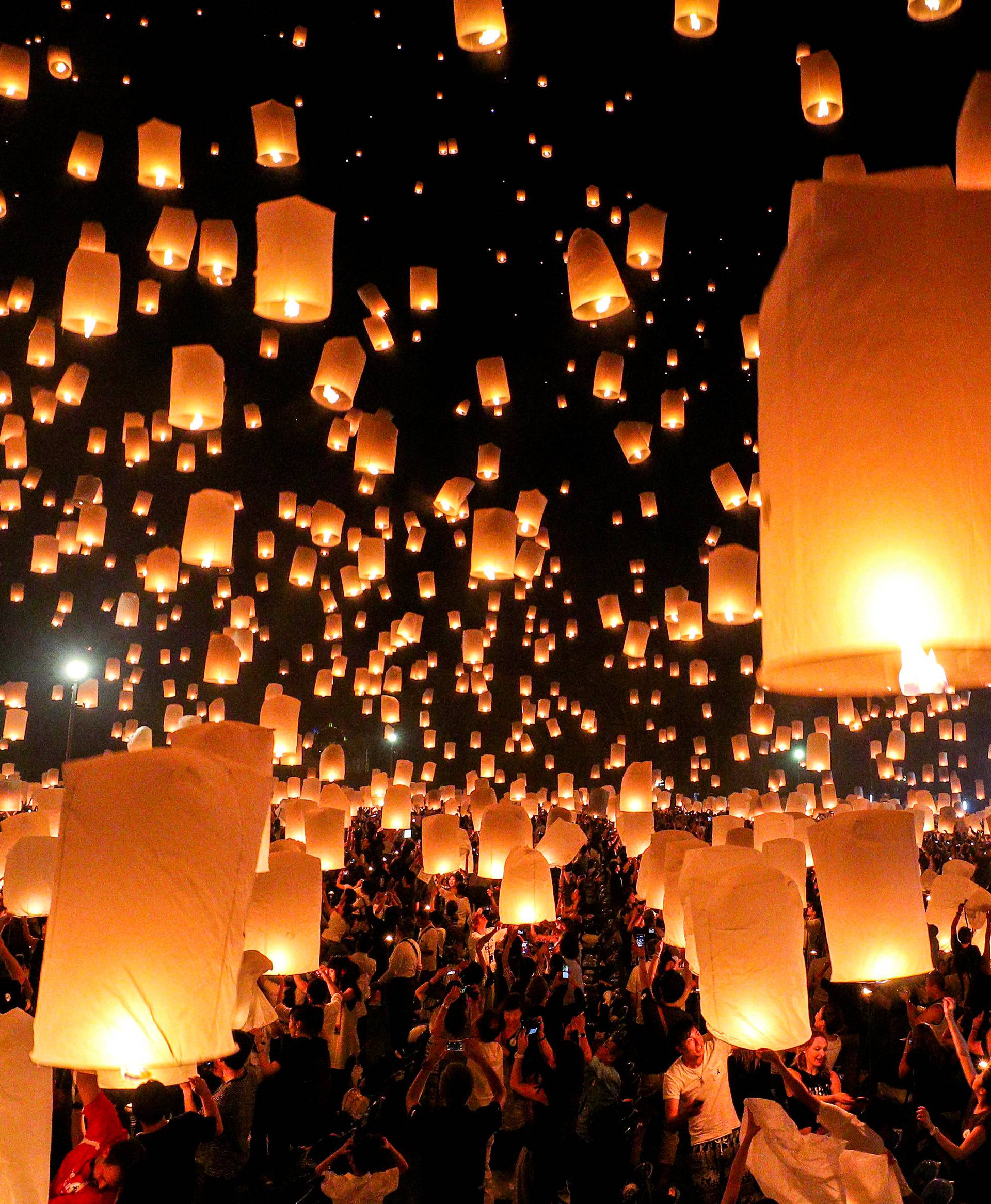 People release floating lanterns during the festival of Yee Peng in the northern capital of Chiang Mai