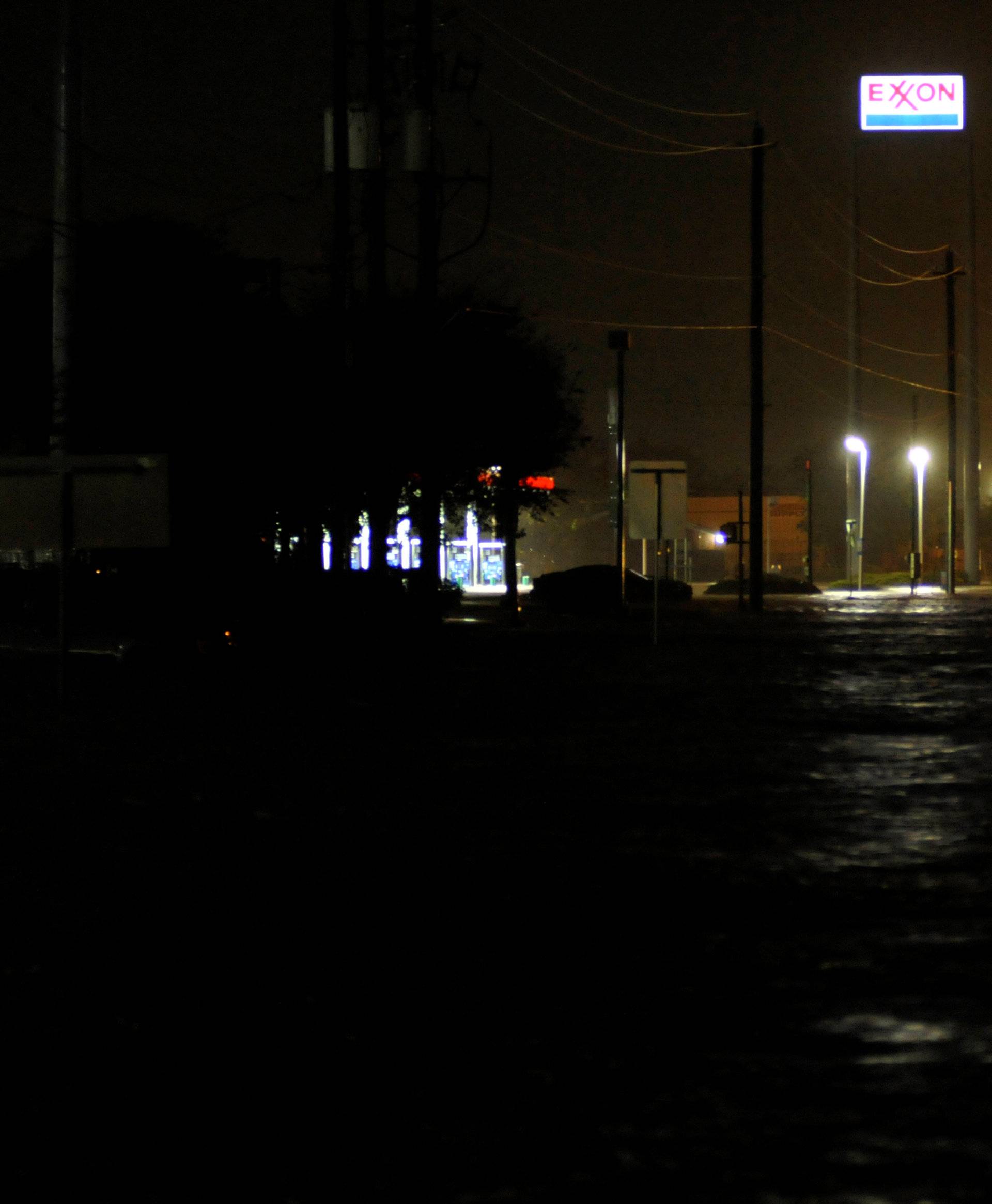Lights stay on at a gas station despite rising floodwater after Hurricane Harvey inundated the Texas Gulf coast with rain causing widespread flooding, in Houston
