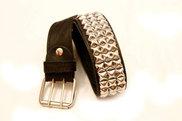 Black leather belt isolated on the white background