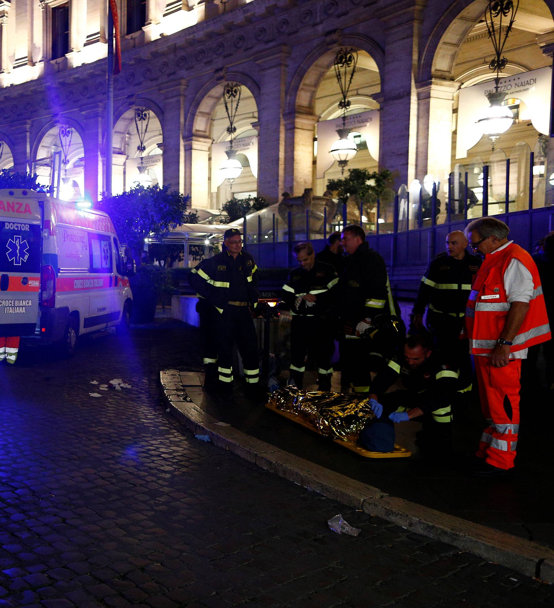 An injured person is seen outside the underground where some of CSKA Moscow supporters were injured in Rome