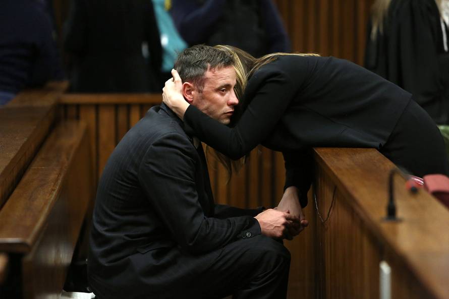 Oscar Pistorius is seen with sister Aimee after proceedings on the third day of his resentencing hearing for the 2013 murder of his girlfriend Reeva Steenkamp in the North Gauteng High Court in Pretoria
