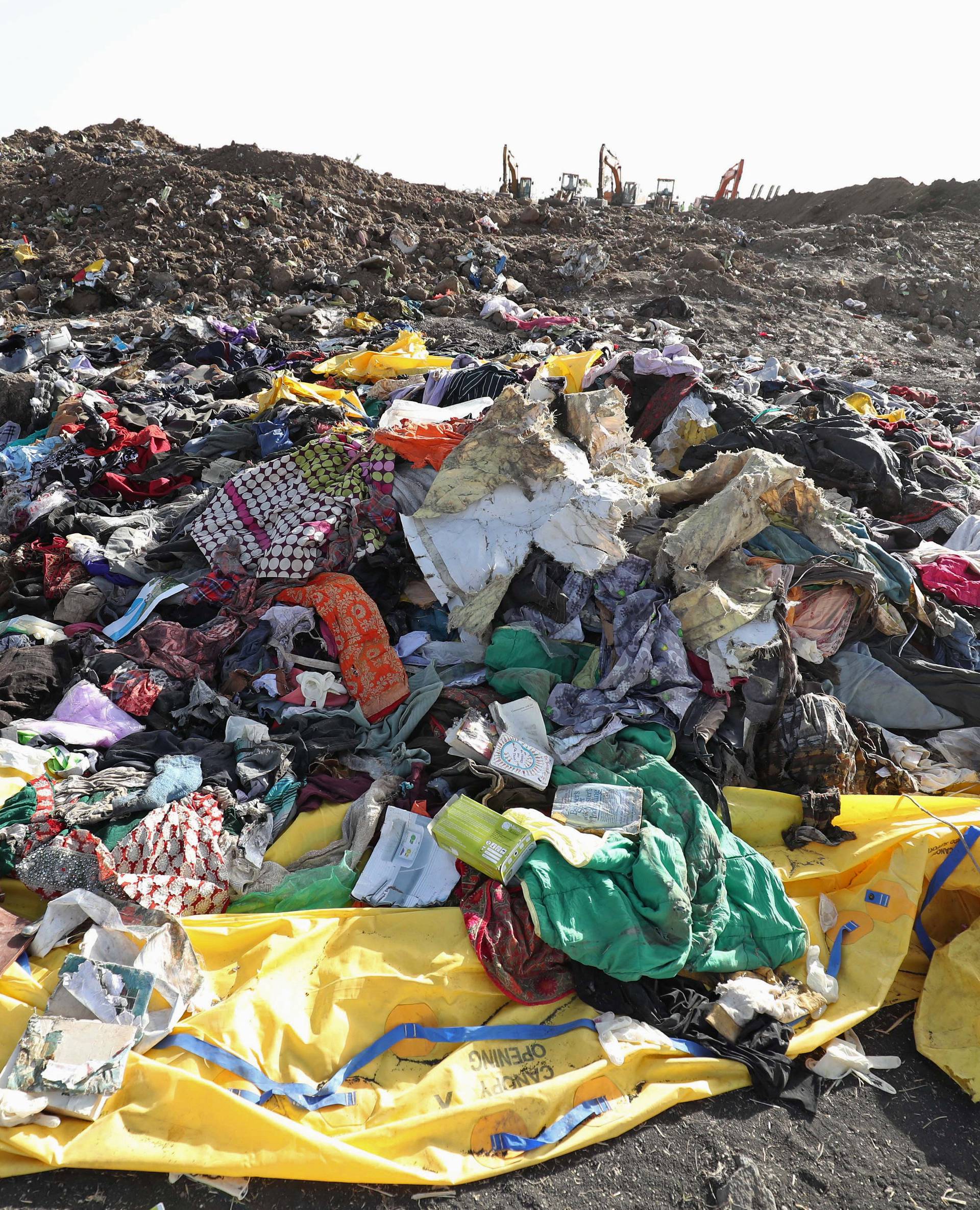 Clothing and personal effects from passengers are seen near the wreckage at the scene of the Ethiopian Airlines Flight ET 302 plane crash, near the town of Bishoftu, southeast of Addis Ababa